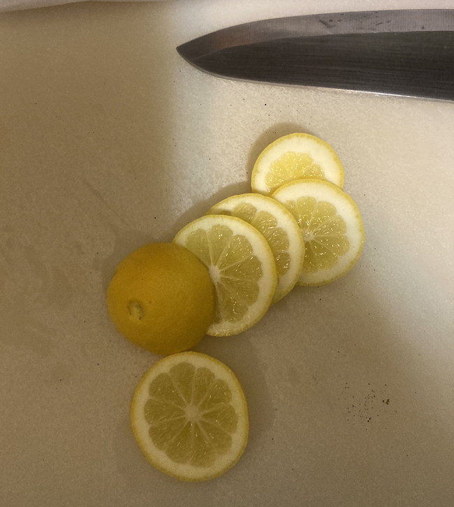 Lemon slices with knife