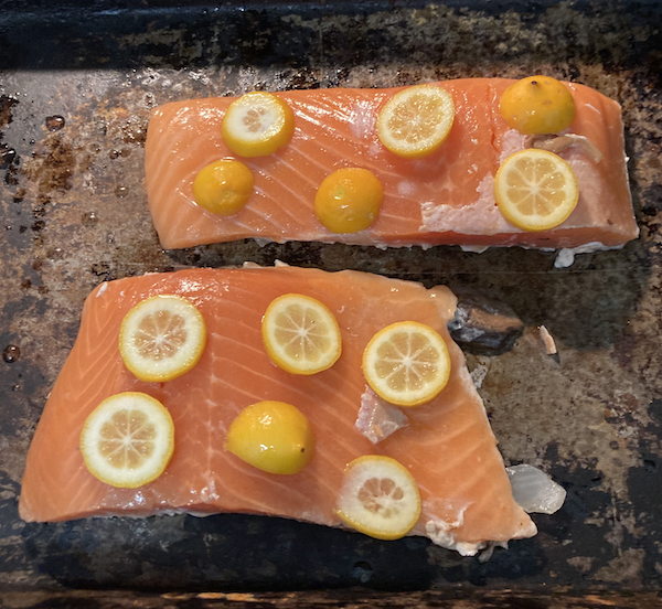 Slices of Lemon on pre-baked salmon